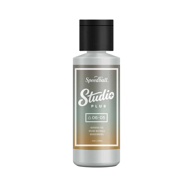Bottle of Speedball Studio Plus paint with a black cap on a white background