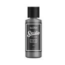 Bottle of Speedball Studio Plus ink on a white background