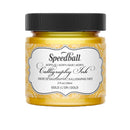 Speedball acrylic calligraphy ink jar in gold on a white background