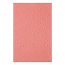 Pink textured paper with musical note pattern on a white background