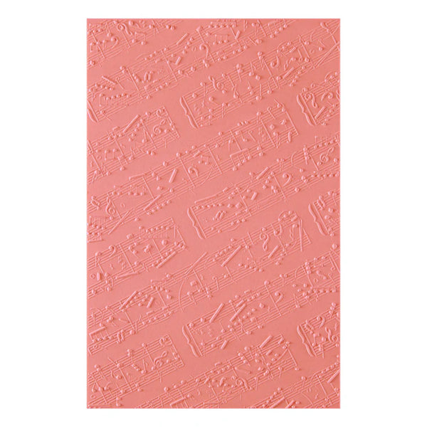 Pink textured paper with musical note pattern on a white background