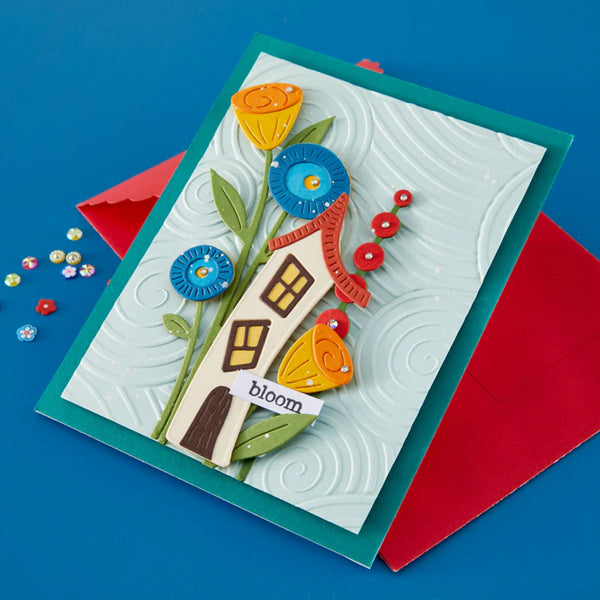 Colorful card with floral design and 'bloom' text on a blue background