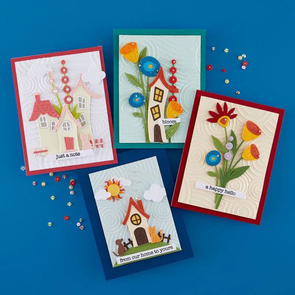 Four colorful greeting cards with house and flower designs on a blue background.