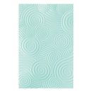 Mint green textured paper with circular patterns on a white background
