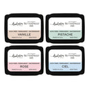 Four ink pads with different colors and labels on a white background