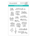 Set of clear stamps with various motivational phrases on a white background, branded 'Spellbinders'.