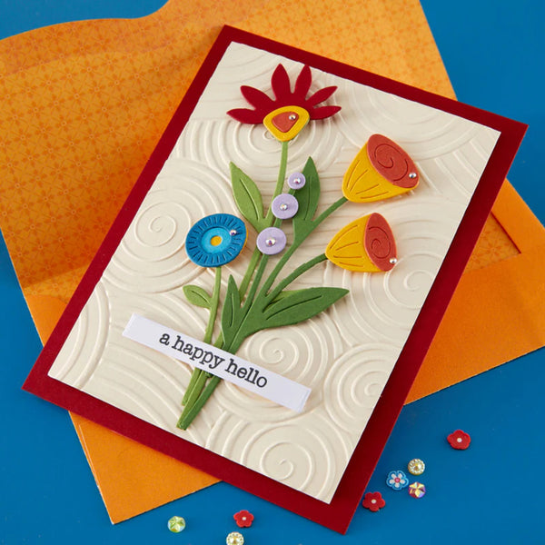 Handmade card with colorful flowers and 'a happy hello' text on a blue and orange background.