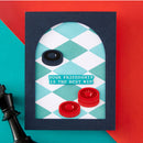 Greeting card with bottle caps and chess pieces on a colorful background