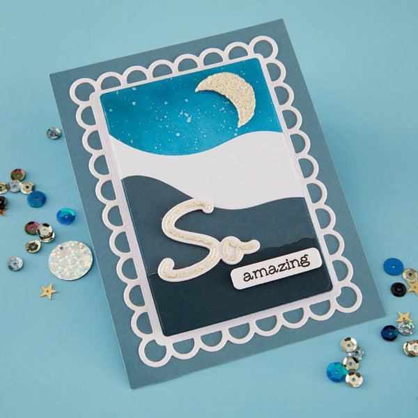 Handmade card with 'So amazing' text and decorative elements on a blue background