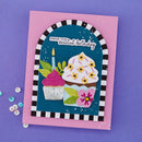 Birthday card with cupcakes and candles on a purple background