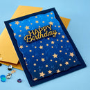 Blue birthday card with gold stars and 'Happy Birthday' text on a blue background
