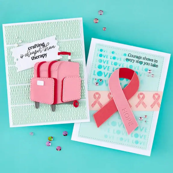 Two handmade cards with pink suitcase and ribbon design on a teal background