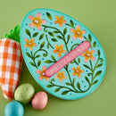 Decorative plate with floral design and 'Happy Spring' text on a green background