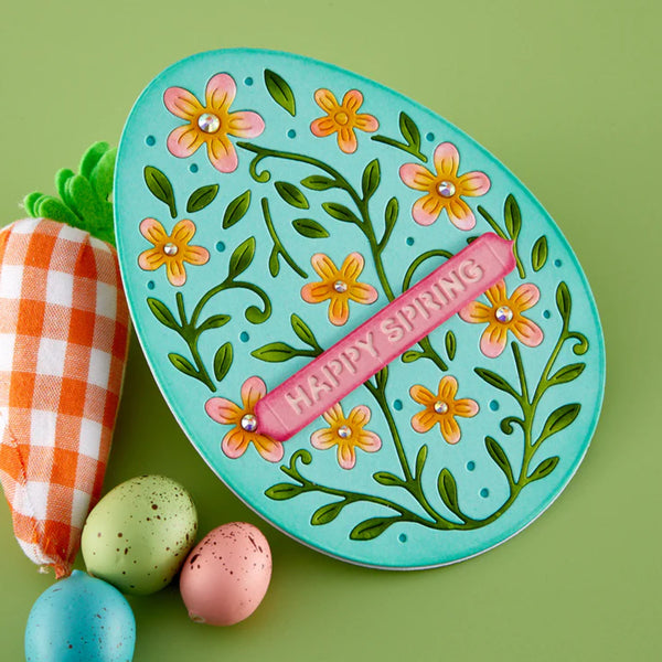 Decorative plate with floral design and 'Happy Spring' text on a green background