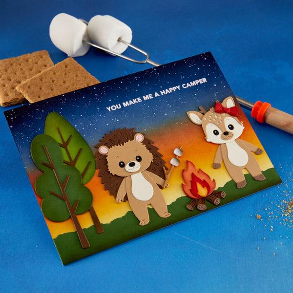 S'mores kit with cartoon bear and deer design on a blue background