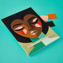 Card with artistic face design and text on a teal background