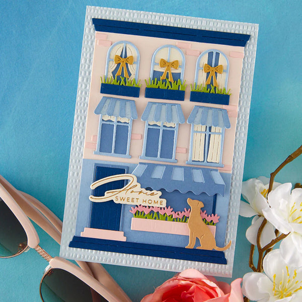 Handmade card with a cute dog and 'Sweet Home' text on a blue background