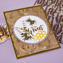 Greeting card with bees and floral design on a purple background