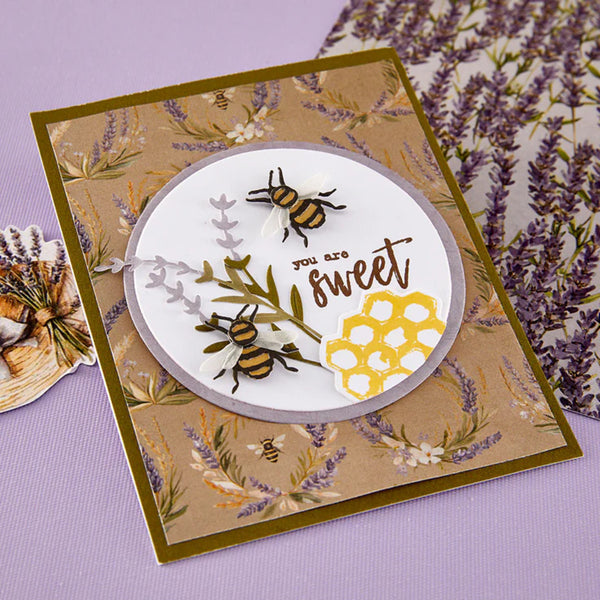 Greeting card with bees and floral design on a purple background