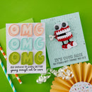 Colorful 'OMG' card with a cartoon robot on a green background