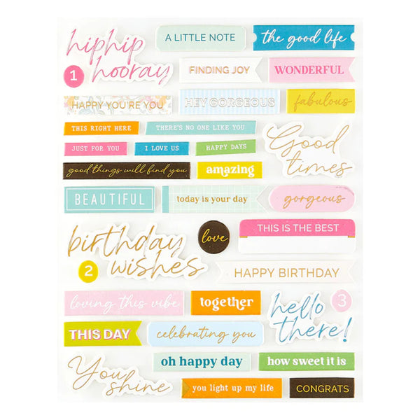 Collection of colorful text stickers with positive phrases on a white background