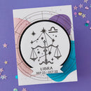 Libra zodiac sign card on a purple background with star decorations