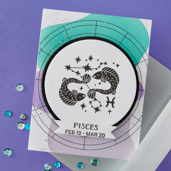 Card with Pisces zodiac sign design on a purple background