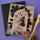 Card with Virgo zodiac design on a purple background