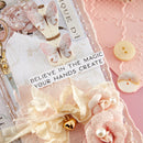 Decorative card with butterflies, flowers, and text on a pink background