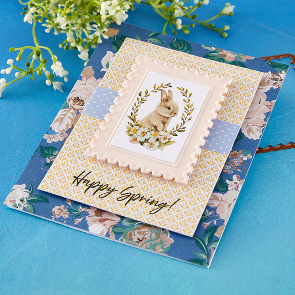 Greeting card with a rabbit illustration and 'Happy Spring!' text on a floral background.