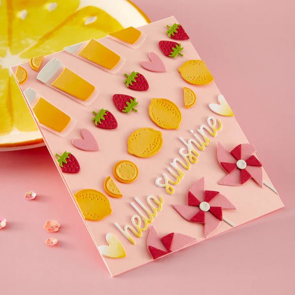 Decorative paper with colorful cutouts on a pink background