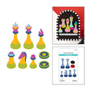 Colorful chess pieces and packaging on a white background