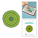 Green circular craft die cut, a card with decorative elements, and a Spellbinders product sheet on a white background.