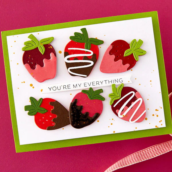 Card with strawberry-shaped cookies and 'You're my everything' text on a pink background