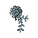 Decorative blue flower with leaves on a white background