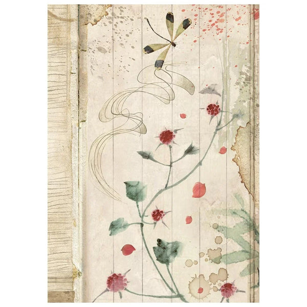 Decorative paper with floral and dragonfly design on a wooden background