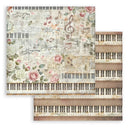 Sheet of music-themed paper with floral and keyboard designs on a white background