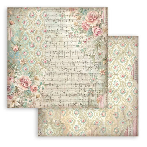 Two sheets of decorative paper with floral and musical note designs on a white background.