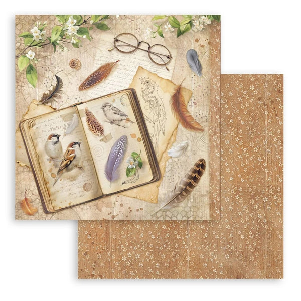 Decorative paper with vintage design featuring an open book, feathers, and glasses on a floral background.
