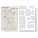Set of white plastic stamps with various shapes and designs on a white background