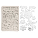 Decorative silicone mold with fantasy-themed designs on a white background