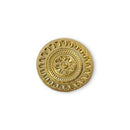 Gold decorative button with intricate design on a white background