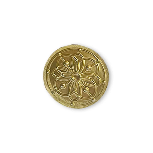 Decorative gold emblem with intricate design on a white background