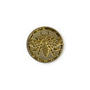 Gold bee-shaped button on a white background