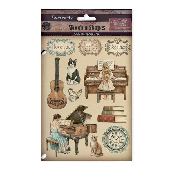 Packaging of Stamperia wooden shapes with musical-themed illustrations on a beige background.