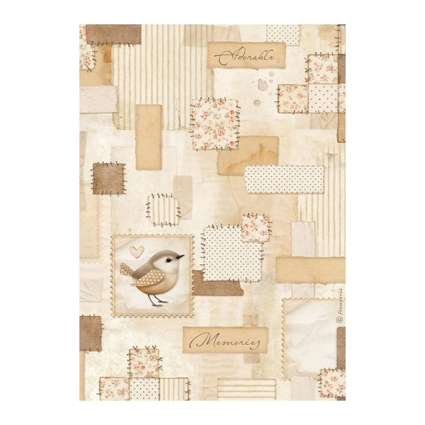 Notebook cover with patchwork design, bird illustration, and text on a white background