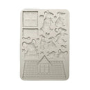 Silicone mold with teddy bear and house designs on a white background