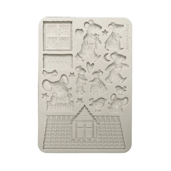 Silicone mold with teddy bear and house designs on a white background