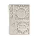 Decorative silicone mold with clock and musical instrument design on a white background