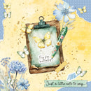 Card with butterflies, flowers, and a pen on a yellow background